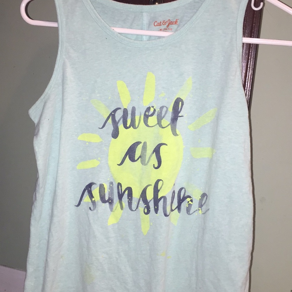A turquoise tank top with a sub and grey writing